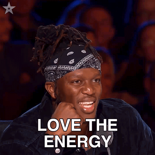 A Man With Dreadlocks And A Bandana On His Head Is Smiling With The Words Love The Energy Below Him GIF