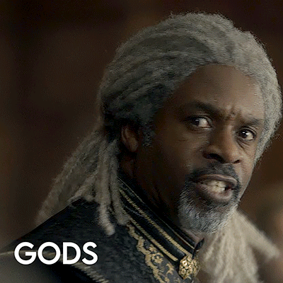 A Man With Dreadlocks And A Beard Has The Word Gods Written Below Him GIF