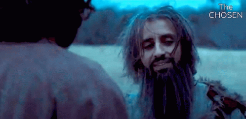 A Man With Dreadlocks And A Beard Is Talking To Another Man In A Movie Called The Chosen GIF