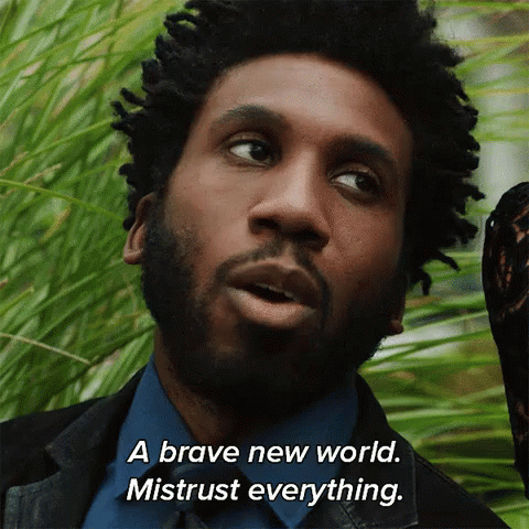 Man With Dreadlocks And Beard Saying Brave New World Mistrust Everything GIF