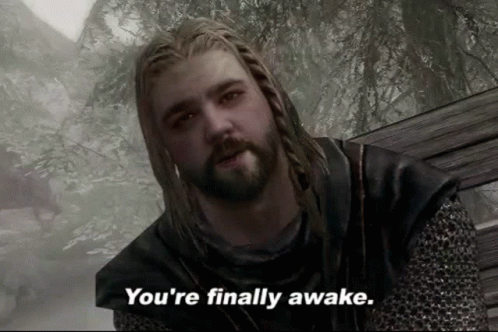 A Man With Dreadlocks And A Beard Says " You 'Re Finally Awake " GIF