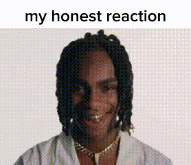 A Man With Dreadlocks And Gold Teeth Is Smiling With The Words `` My Honest Reaction '' Above Him . GIF