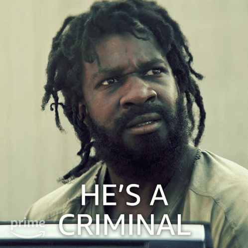A Man With Dreadlocks And The Words He 'S A Criminal On The Bottom GIF