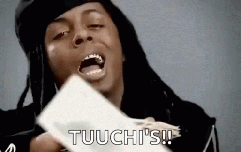 A Man With Dreadlocks Is Holding A Bunch Of Money In His Hands And Shouting . GIF