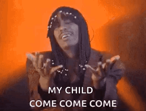 A Man With Dreadlocks Is Holding His Hands Up In The Air And Says `` My Child Come Come Come '' . GIF