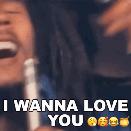 A Man With Dreadlocks Is Laughing With The Words I Wanna Love You GIF