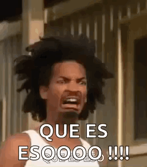 A Man With Dreadlocks Is Making A Funny Face And Says `` Que Es Esoooo !!! '' . GIF