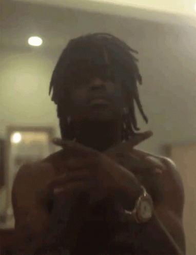 A Man With Dreadlocks Is Taking A Picture Of Himself GIF