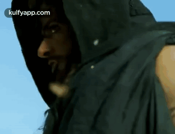 A Man With Dreadlocks Is Wearing A Black Jacket With A Hood GIF