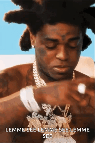A Man With Dreadlocks Is Wearing A Necklace That Says Lemme See Lemme See Lemme See .. GIF