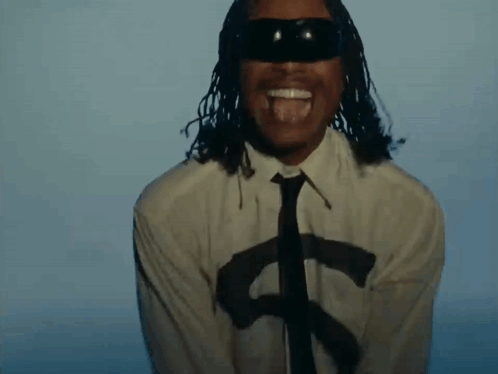 A Man With Dreadlocks Is Wearing A White Shirt And Tie And Sunglasses . GIF
