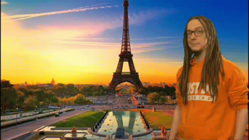 A Man With Dreadlocks Is Wearing An Orange Shirt That Says Just A Thing GIF