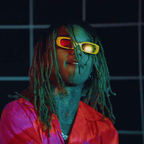 A Man With Dreadlocks Is Wearing Sunglasses And A Red Shirt GIF