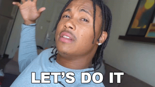 A Man With Dreadlocks Says Let 'S Do It With His Hands In The Air GIF