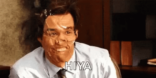 A Man With Duct Tape On His Face Is Smiling And Says Hiya GIF