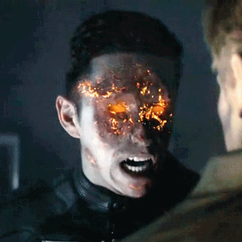 A Man With Flames Coming Out Of His Face Is Talking To Another Man GIF