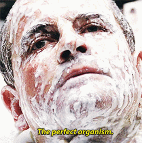 A Man With Foam On His Face And The Words " The Perfect Organism " Above Him GIF