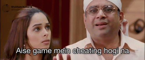 A Man With Glasses And A Bandana On His Head Says " Aise Game Mein Cheating Hogi Na " Next To A Woman GIF