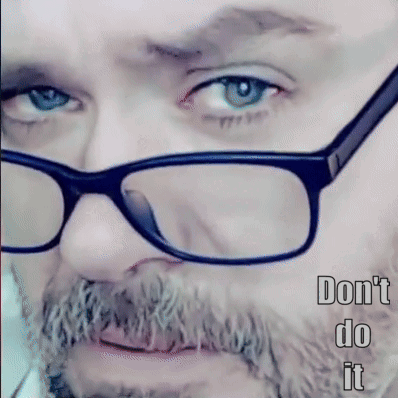 A Man With Glasses And A Beard Has The Words " Do N't Do It " Below Him GIF