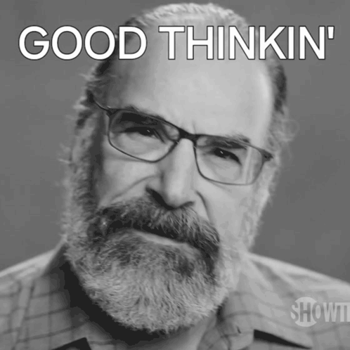 A Man With Glasses And A Beard Has The Words Good Thinkin ' On His Face GIF