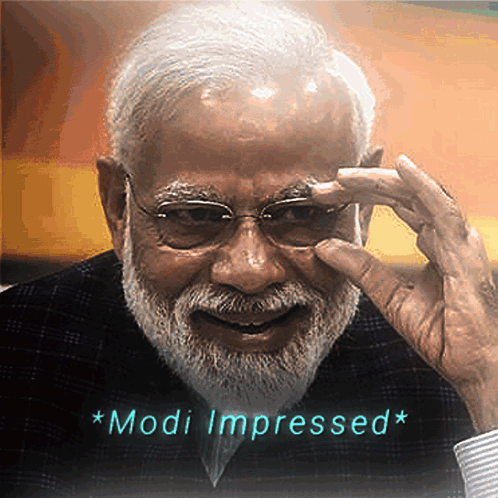 A Man With Glasses And A Beard Has The Words Modi Impressed Written Below Him GIF