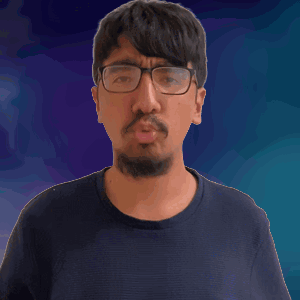 A Man With Glasses And A Beard Holds His Finger To His Lips GIF