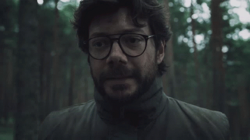 A Man With Glasses And A Beard In A Forest GIF