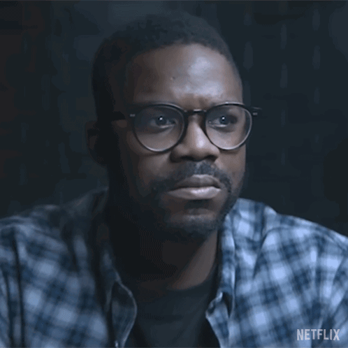 A Man With Glasses And A Beard Is Asking " Who Are They " GIF