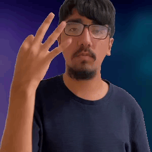 A Man With Glasses And A Beard Is Giving A Middle Finger GIF