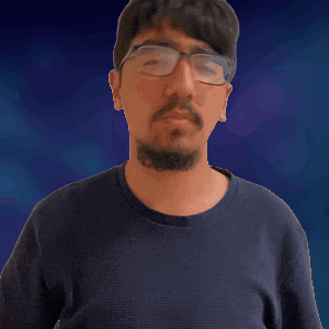 A Man With Glasses And A Beard Is Making A Gesture GIF