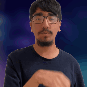 A Man With Glasses And A Beard Is Making A Silly Face GIF