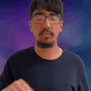 A Man With Glasses And A Beard Is Making A Thumbs Up Sign GIF