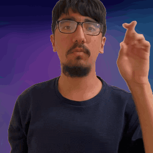 A Man With Glasses And A Beard Is Pointing His Finger GIF