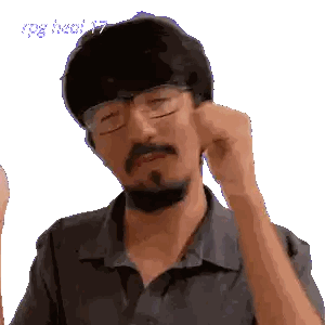 a man with glasses and a beard is scratching his ear