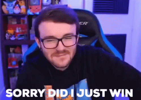 A Man With Glasses And A Beard Is Sitting In A Gaming Chair And Saying Sorry Did I Just Win . GIF
