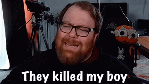 A Man With Glasses And A Beard Is Sitting In Front Of A Camera And Saying They Killed My Boy . GIF