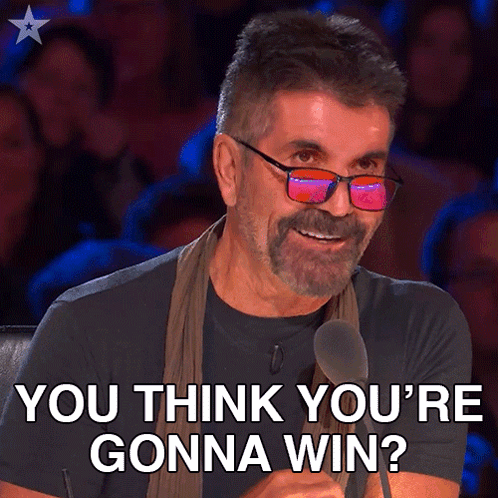 A Man With Glasses And A Beard Is Smiling And Says You Think You 'Re Gonna Win GIF