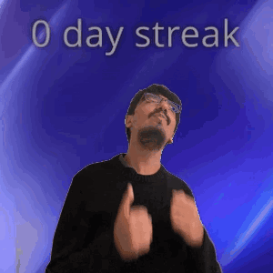 A Man With Glasses And A Beard Is Standing In Front Of A Blue Background With The Words 0 Day Streak On It GIF