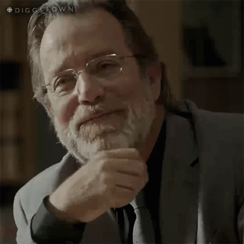 A Man With Glasses And A Beard Is Thinking GIF