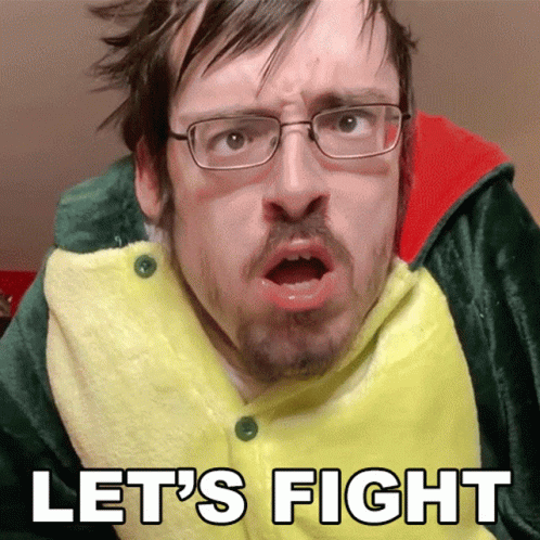 A Man With Glasses And A Beard Is Wearing A Green And Yellow Outfit That Says " Let 'S Fight " GIF