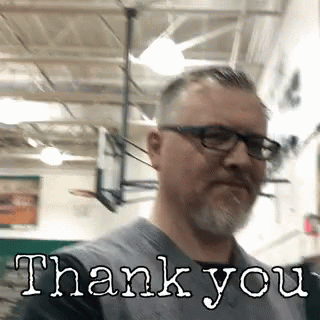 A Man With Glasses And A Beard Is Wearing A Shirt That Says Thank You GIF