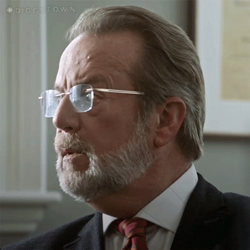 A Man With Glasses And A Beard Is Wearing A Suit And Tie With The Hashtag #Diggstown GIF
