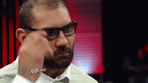 A Man With Glasses And A Beard Is Wearing A White Shirt And Tie GIF