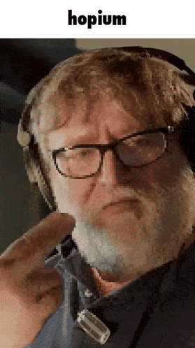 A Man With Glasses And A Beard Is Wearing Headphones And The Word Hopium Is On The Bottom GIF