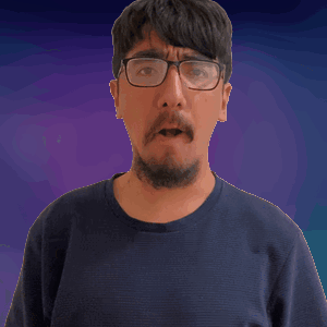 A Man With Glasses And A Beard Looks At The Camera GIF