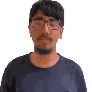 a man with glasses and a beard making a face