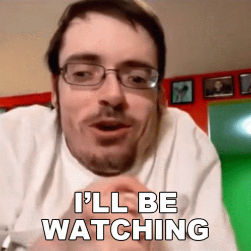 A Man With Glasses And A Beard Says I 'Ll Be Watching GIF