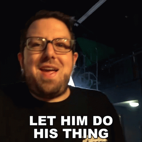 A Man With Glasses And A Beard Says " Let Him Do His Thing " GIF