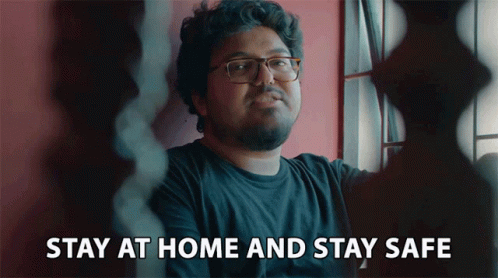 A Man With Glasses And A Beard Says Stay At Home And Stay Safe GIF