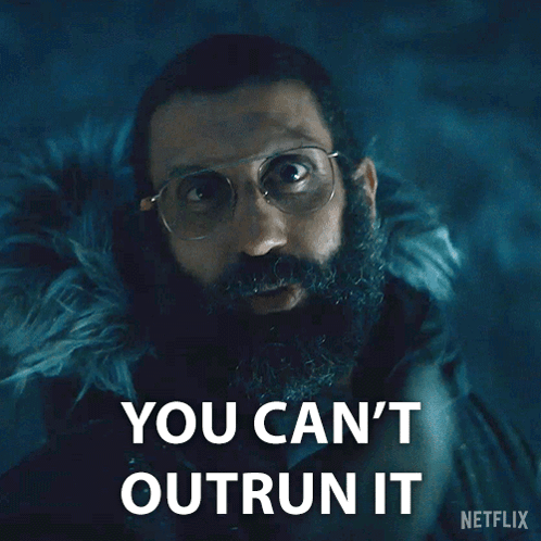A Man With Glasses And A Beard Says You Can 'T Outrun It On A Netflix Poster GIF